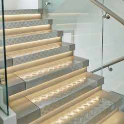 Custom-cut aluminum checker plate for stair treads